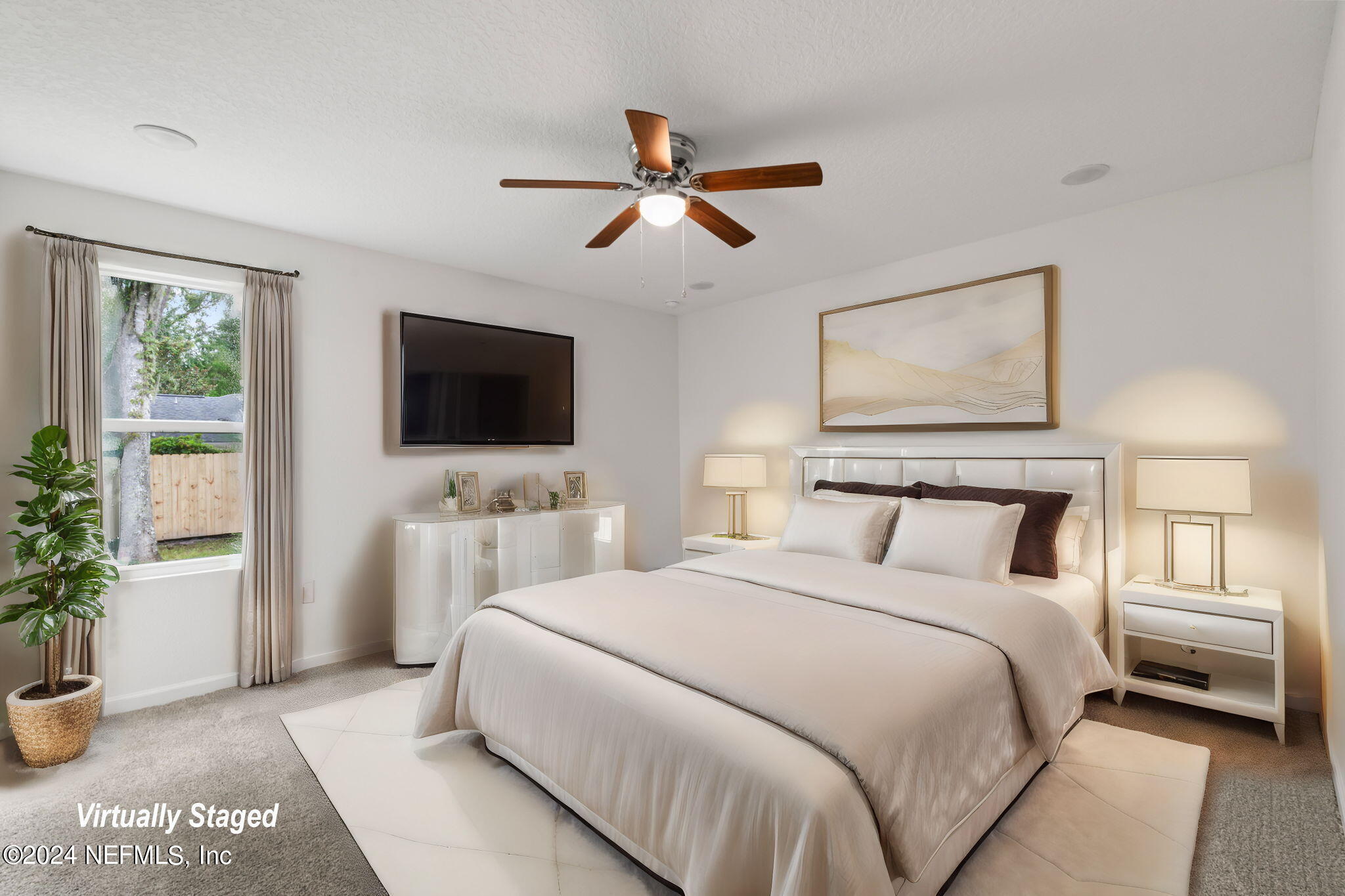 1014 Floyd Street Fleming Island, FL 32003 - Photo 29 of 48 a bedroom with a bed and a flat screen tv