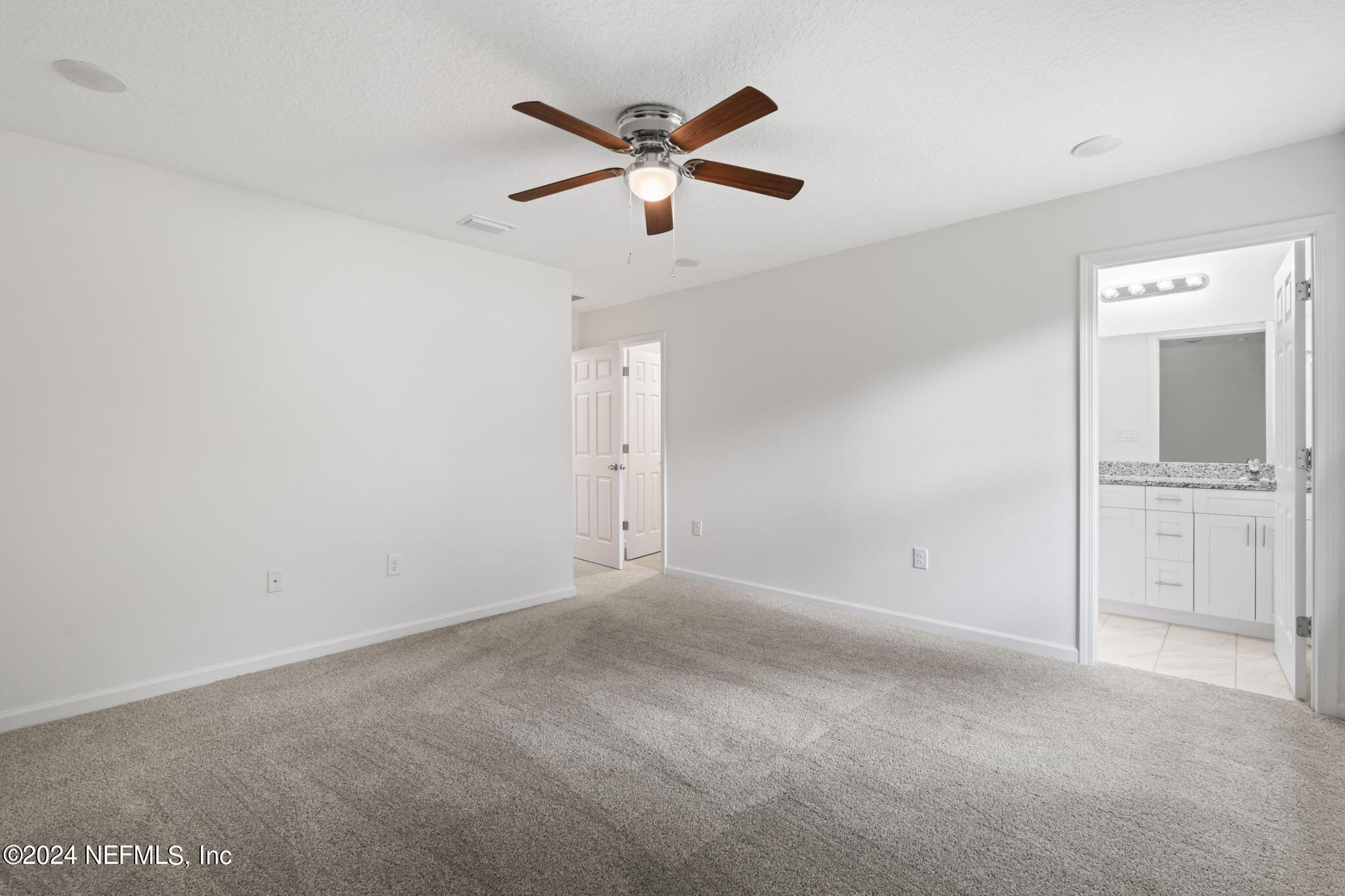 1014 Floyd Street Fleming Island, FL 32003 - Photo 30 of 48 an empty room with closet and windows