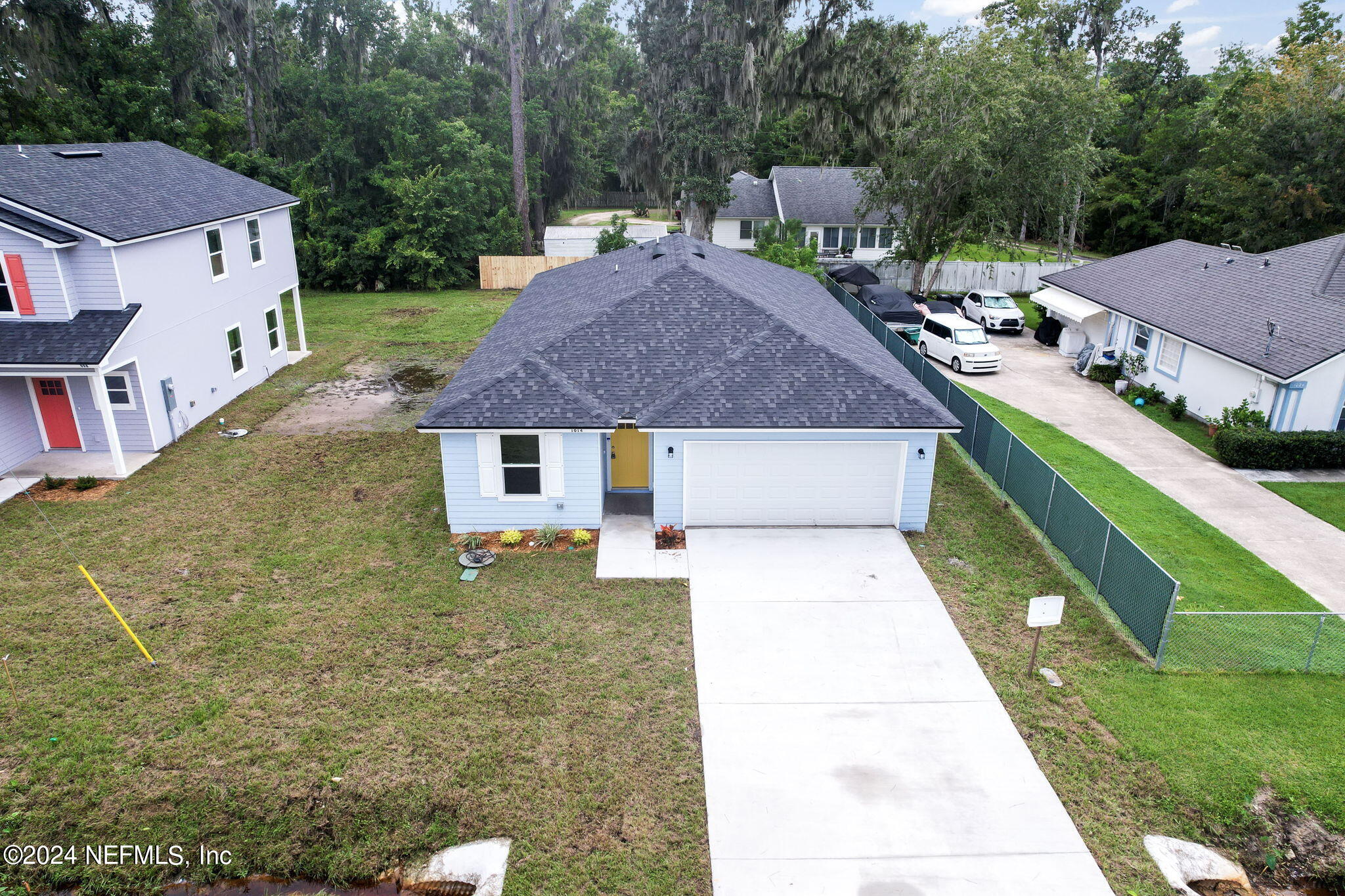1014 Floyd Street Fleming Island, FL 32003 - Photo 34 of 48 a aerial view of a house with a yard table and chairs