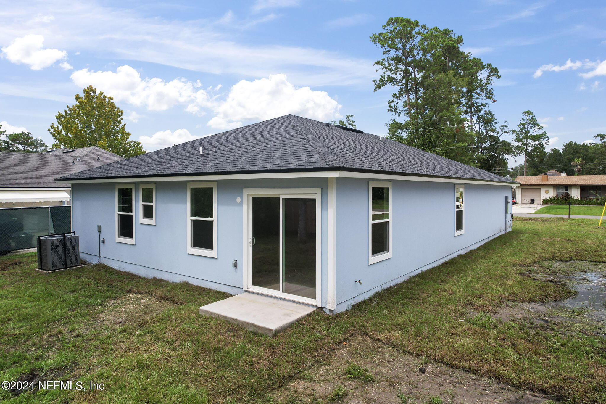1014 Floyd Street Fleming Island, FL 32003 - Photo 35 of 48 a view of a house with a yard