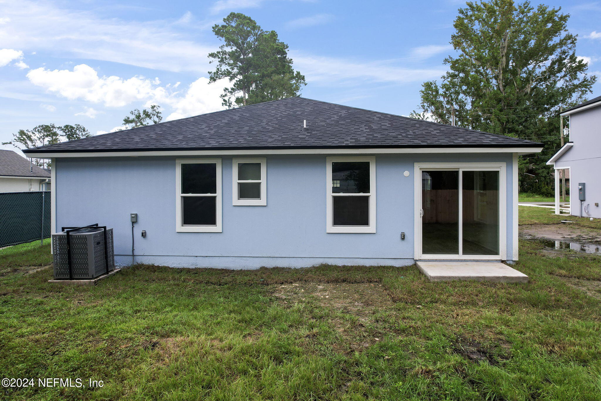 1014 Floyd Street Fleming Island, FL 32003 - Photo 36 of 48 a house that has a wooden fence in front of it