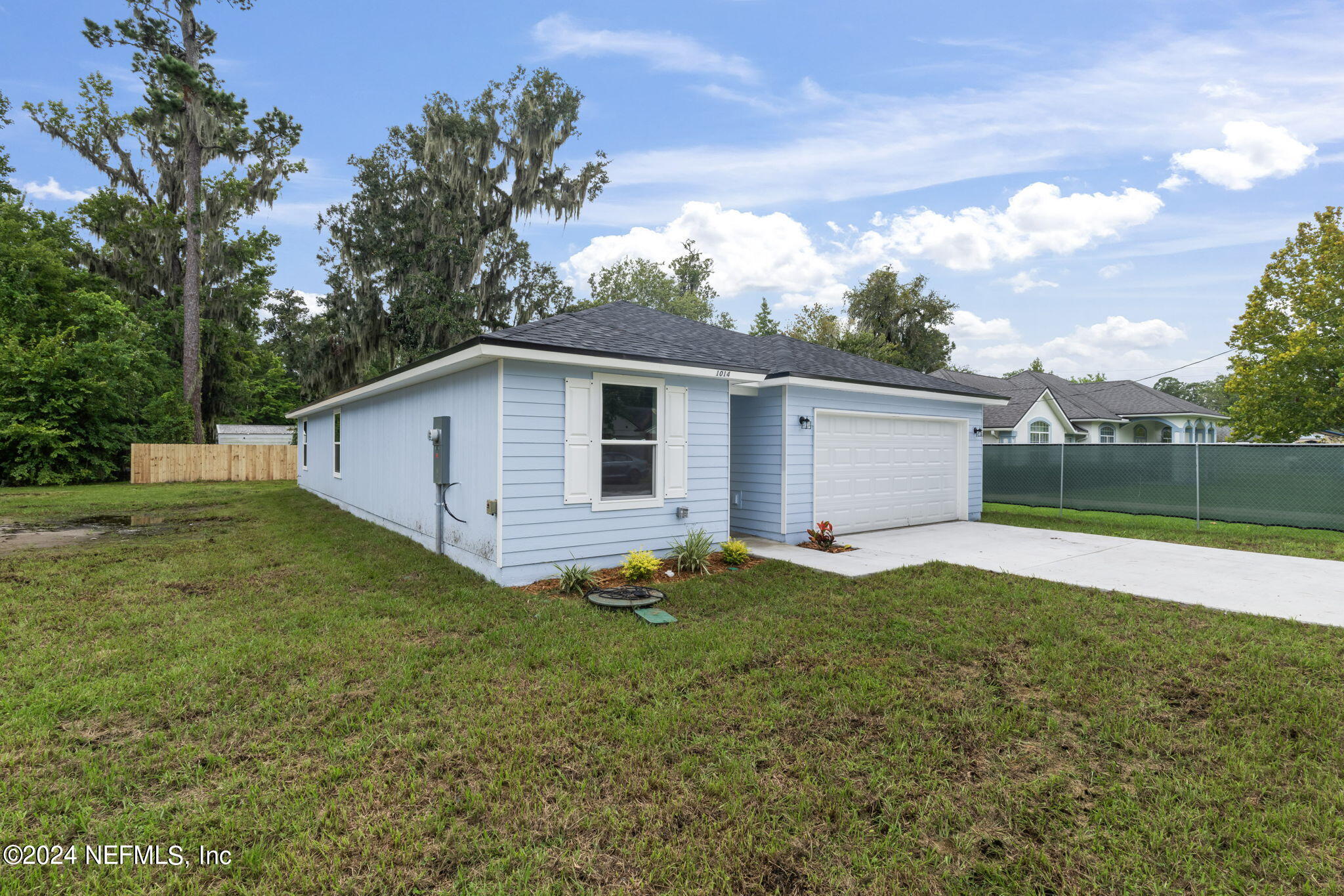1014 Floyd Street Fleming Island, FL 32003 - Photo 38 of 48 a view of a backyard with a garden