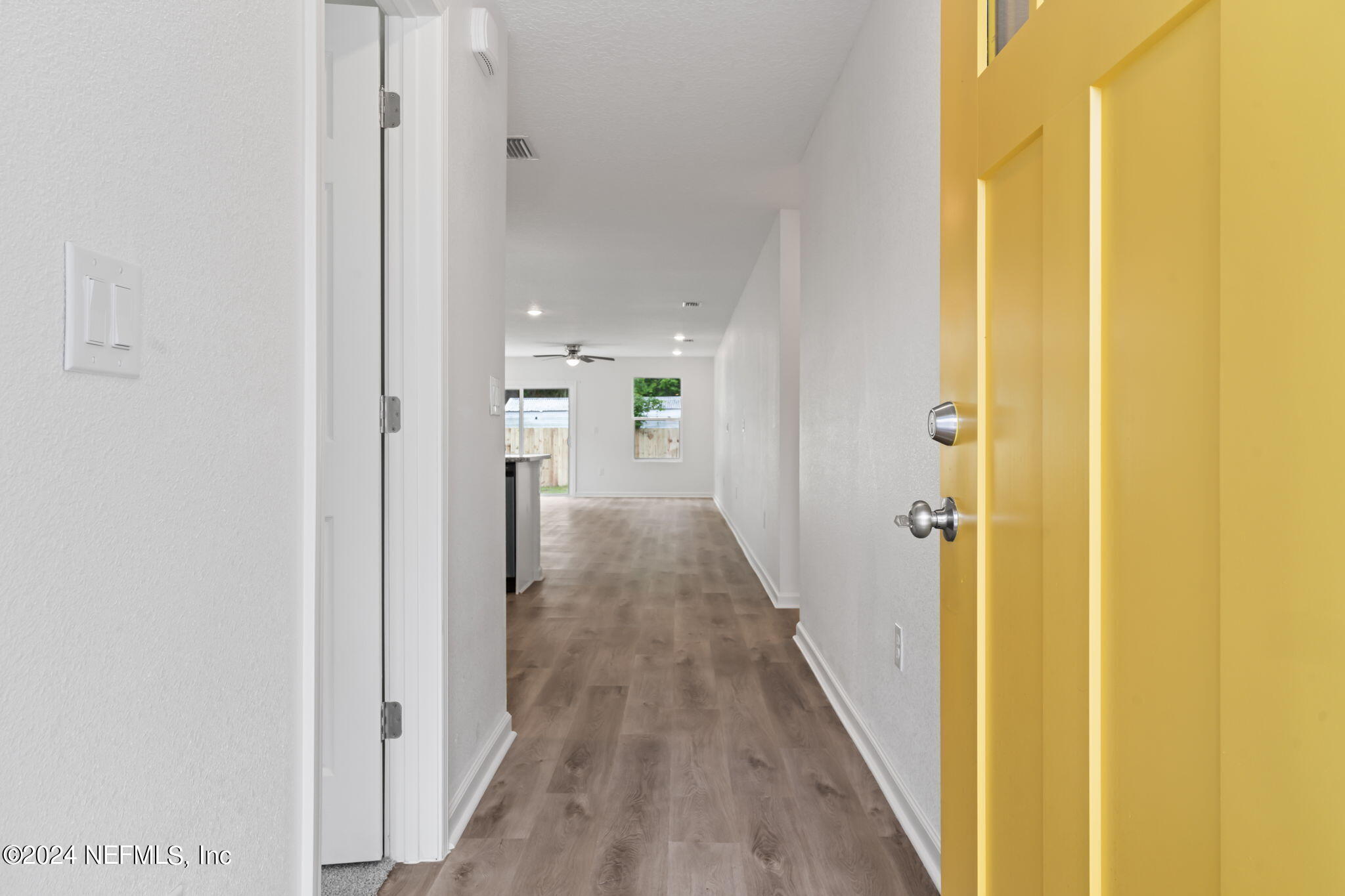 1014 Floyd Street Fleming Island, FL 32003 - Photo 4 of 48 a view of a hallway with wooden floor