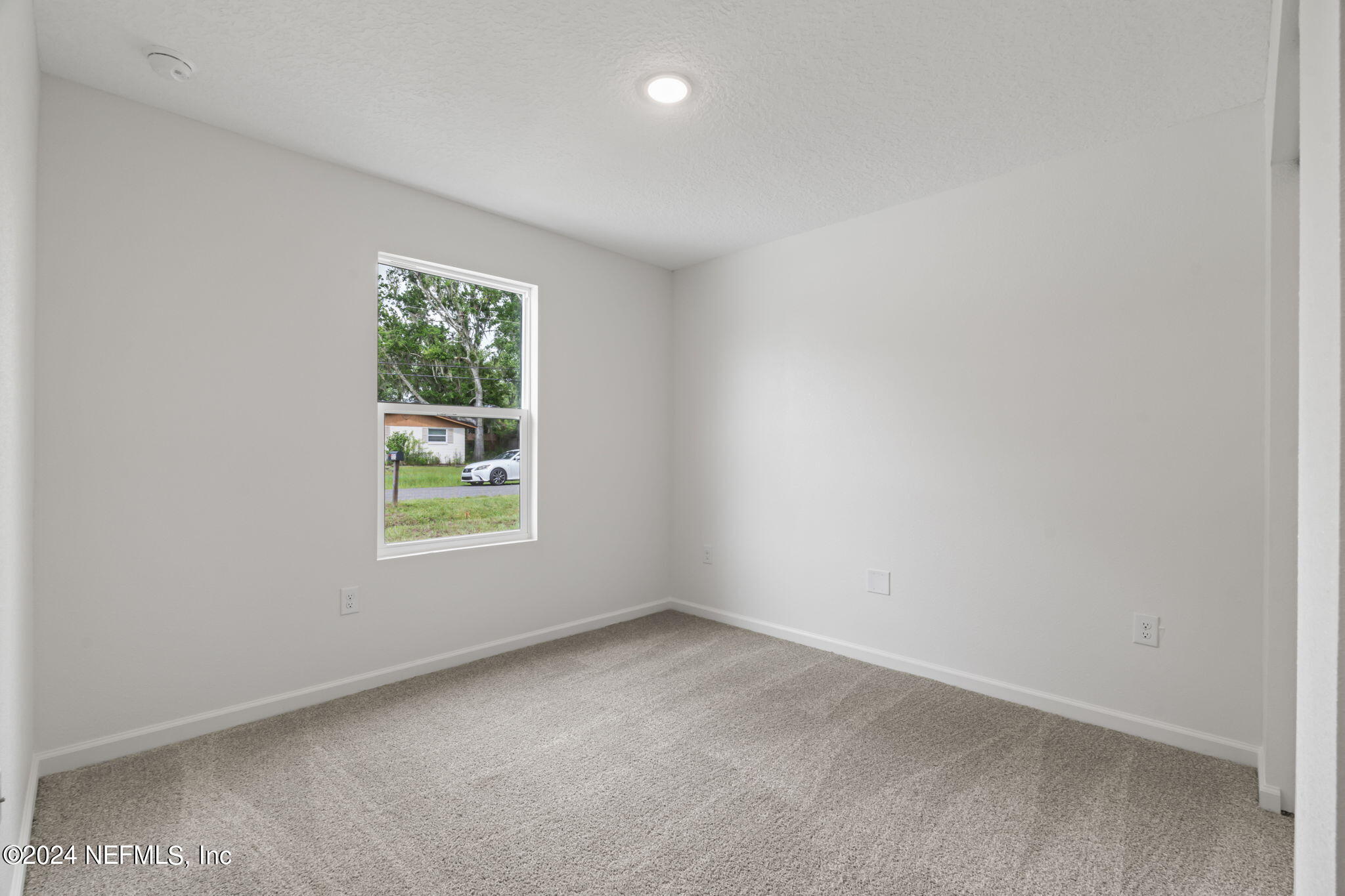 1014 Floyd Street Fleming Island, FL 32003 - Photo 6 of 48 an empty room with windows