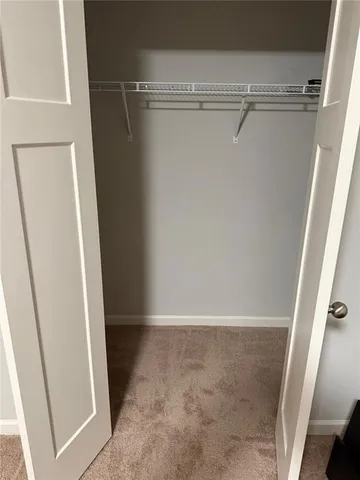 a bathroom with a sink vanity mirror and toilet