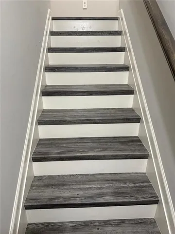 a view of a house with backyard and deck