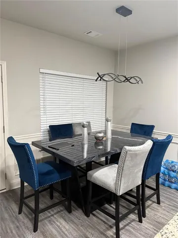 a bathroom with a granite countertop toilet sink and mirror