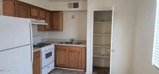 a kitchen with a stove and a microwave