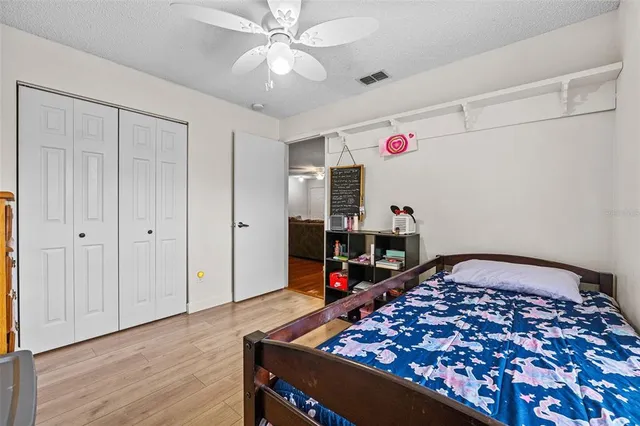 a bedroom with furniture and a chandelier
