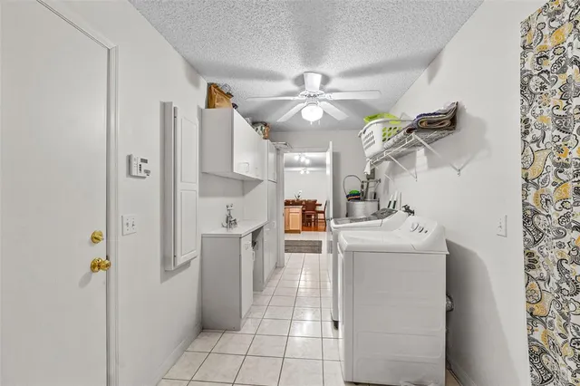 a kitchen with stainless steel appliances a refrigerator and a stove top oven