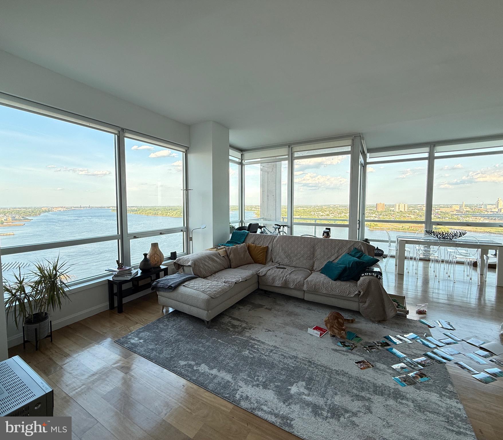 901 North Penn Street, Unit R2101 Philadelphia, PA 19123 - Photo 18 of 33 a living room with furniture and floor to ceiling windows