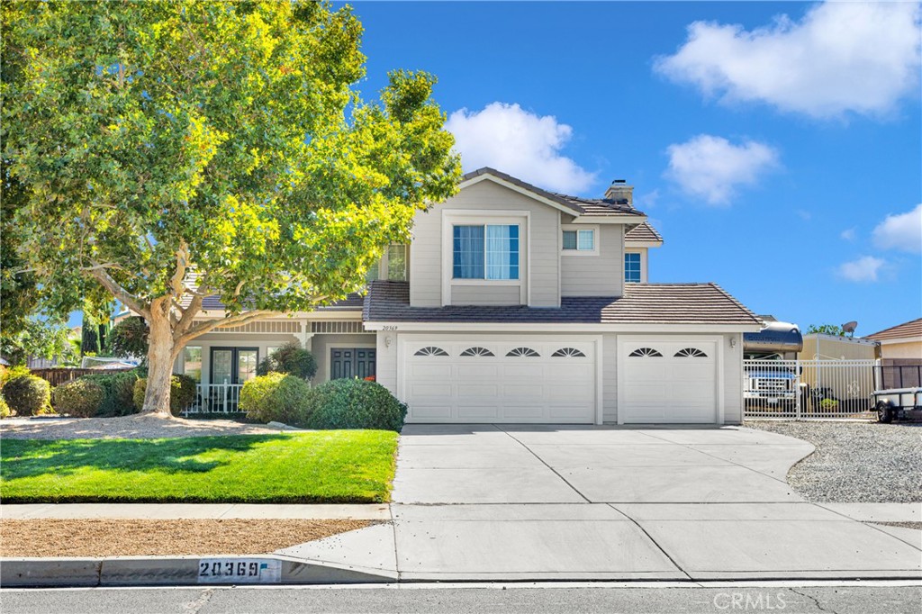20369 Pahute Road Apple Valley, CA 92308 - Photo 1 of 1 a front view of a house with a yard and garage