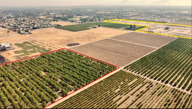 an outdoor space with wooden floor and pool