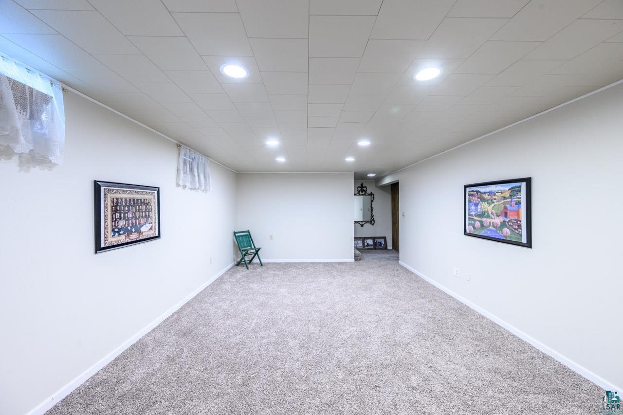 301 2nd Street North Biwabik, MN 55708 - Photo 21 of 43 Spacious room featuring neutral carpeting, light-toned walls, and recessed lighting