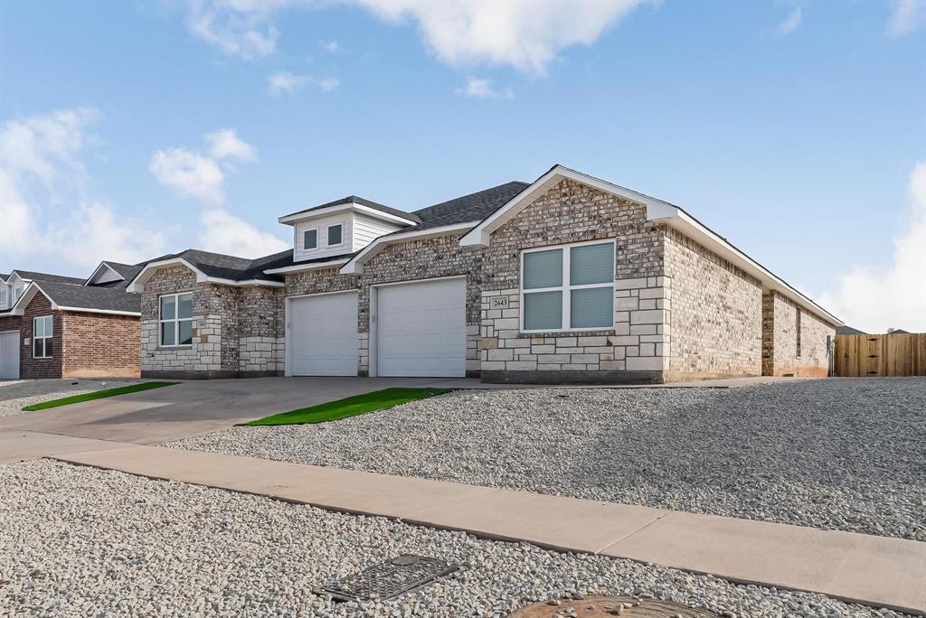6121 Princess Lane Abilene, TX 79606 - Photo 1 of 1 a front view of a house with a yard and garage