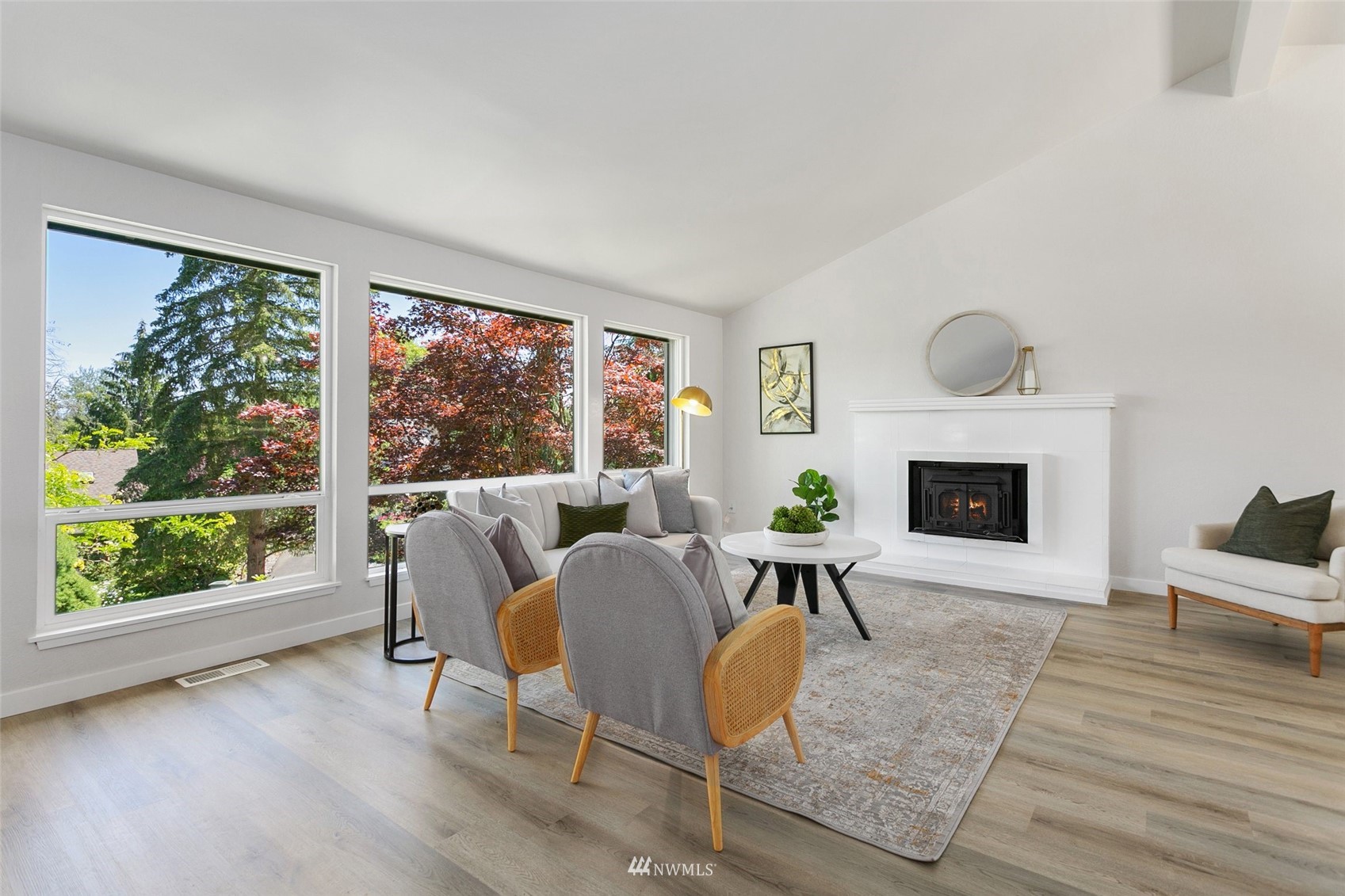 22130 5th Drive Southeast Bothell, WA 98021 - Photo 4 of 36 a dining room with furniture a fireplace and wooden floor