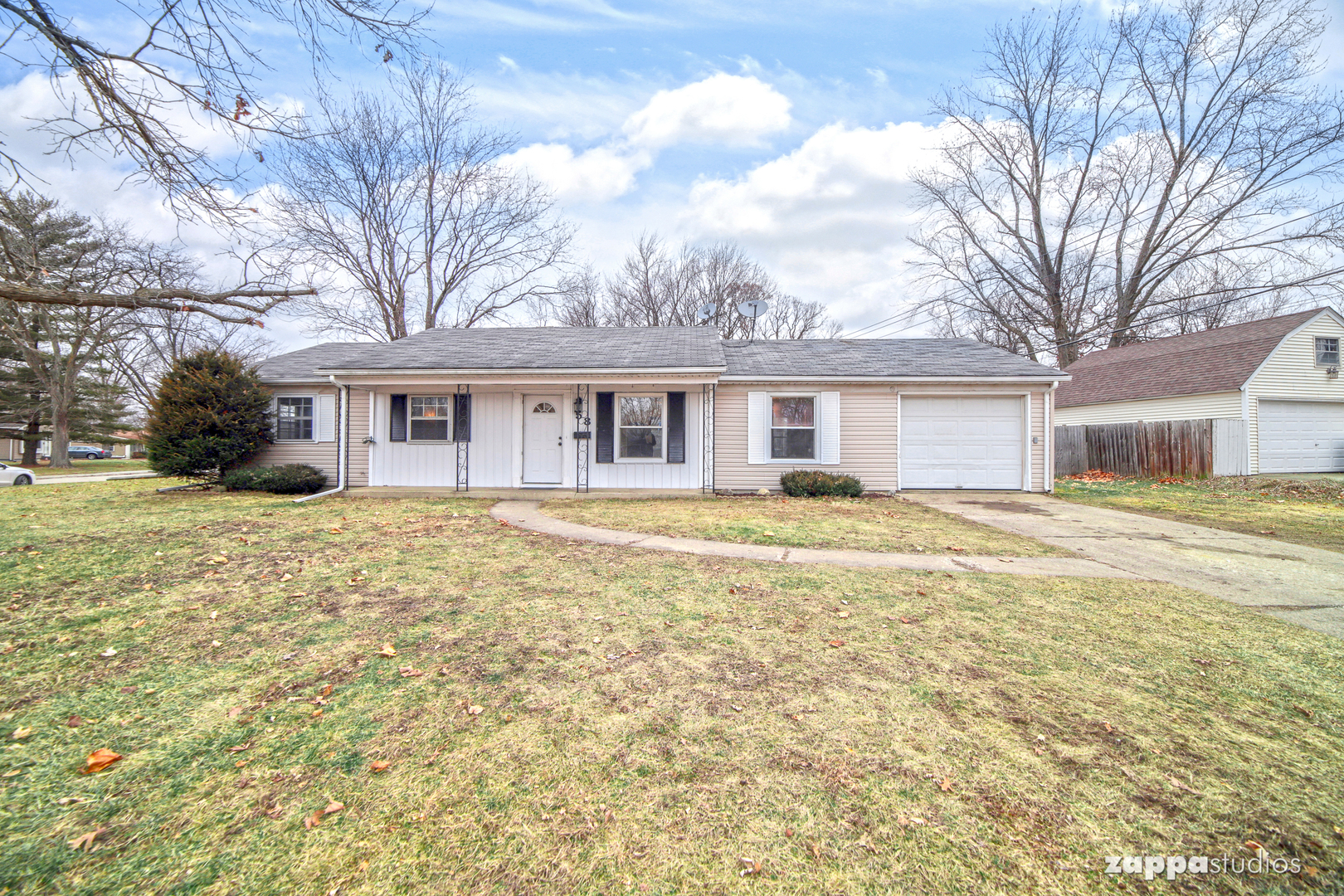 58 Long Beach Road Montgomery, IL 60538 - Photo 1 of 35 a house that has a large tree in front of a house