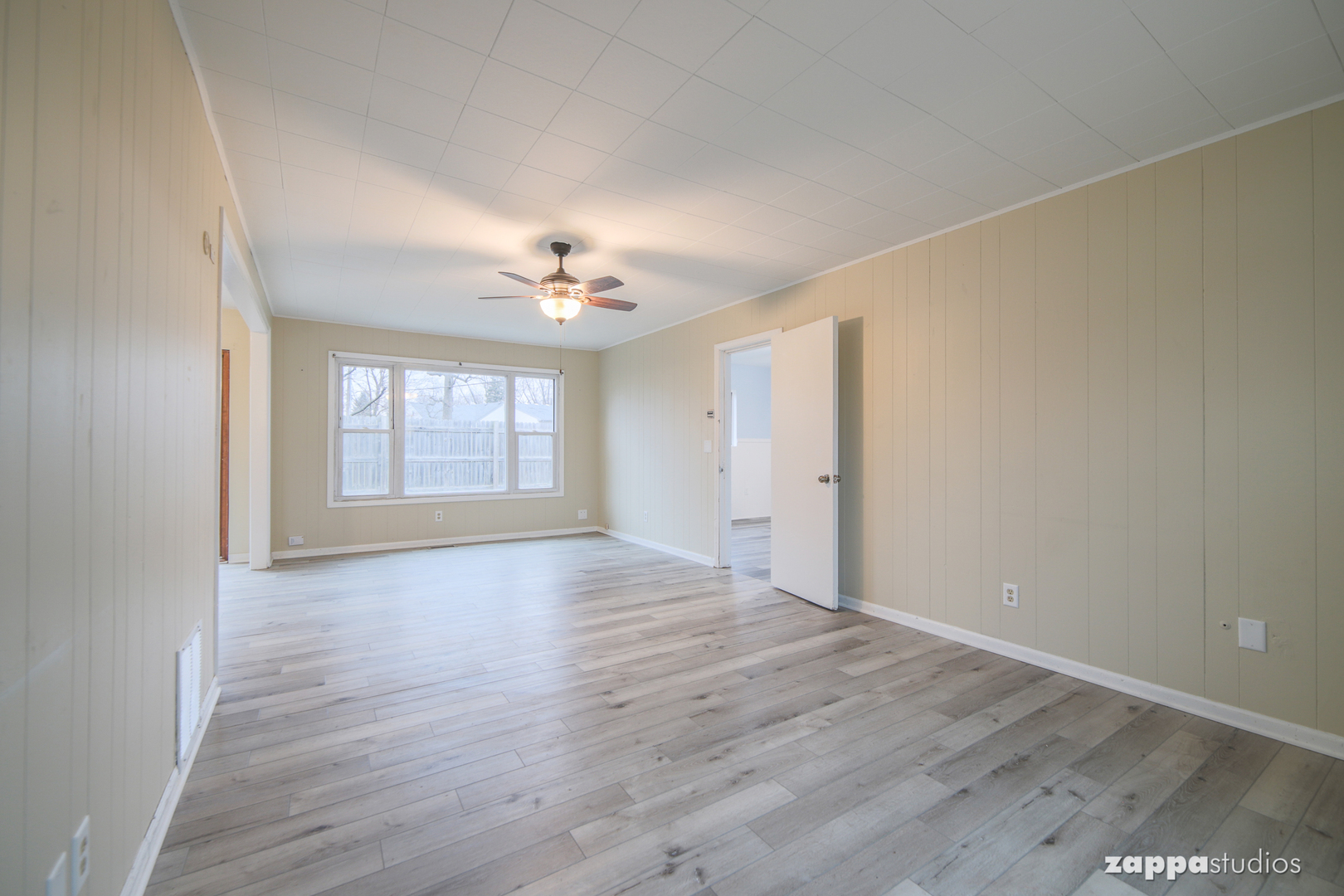 58 Long Beach Road Montgomery, IL 60538 - Photo 18 of 35 wooden floor in an empty room with a window
