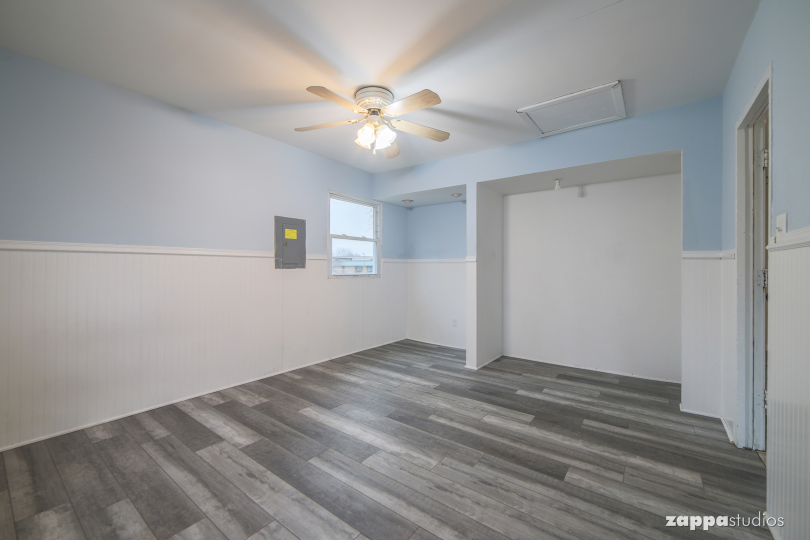 58 Long Beach Road Montgomery, IL 60538 - Photo 20 of 35 an empty room with wooden floor fan and windows