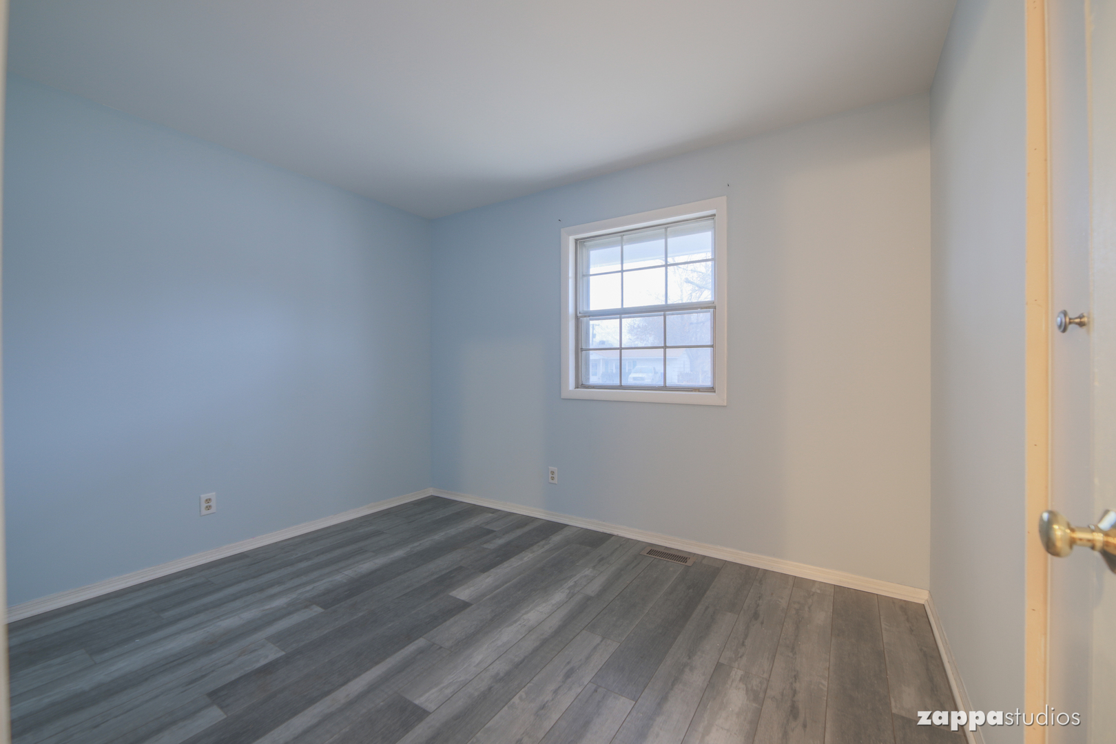 58 Long Beach Road Montgomery, IL 60538 - Photo 23 of 35 an empty room with wooden floor and windows