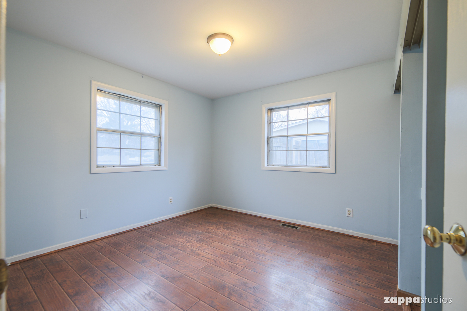 58 Long Beach Road Montgomery, IL 60538 - Photo 28 of 35 an empty room with wooden floor and windows