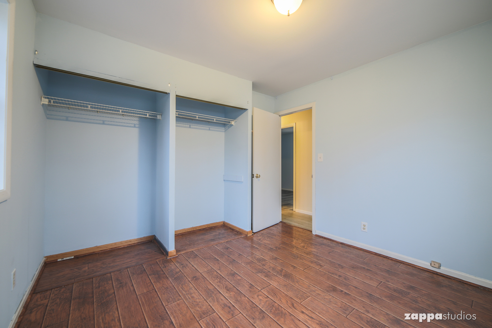 58 Long Beach Road Montgomery, IL 60538 - Photo 29 of 35 a view of an empty room with wooden floor and closet