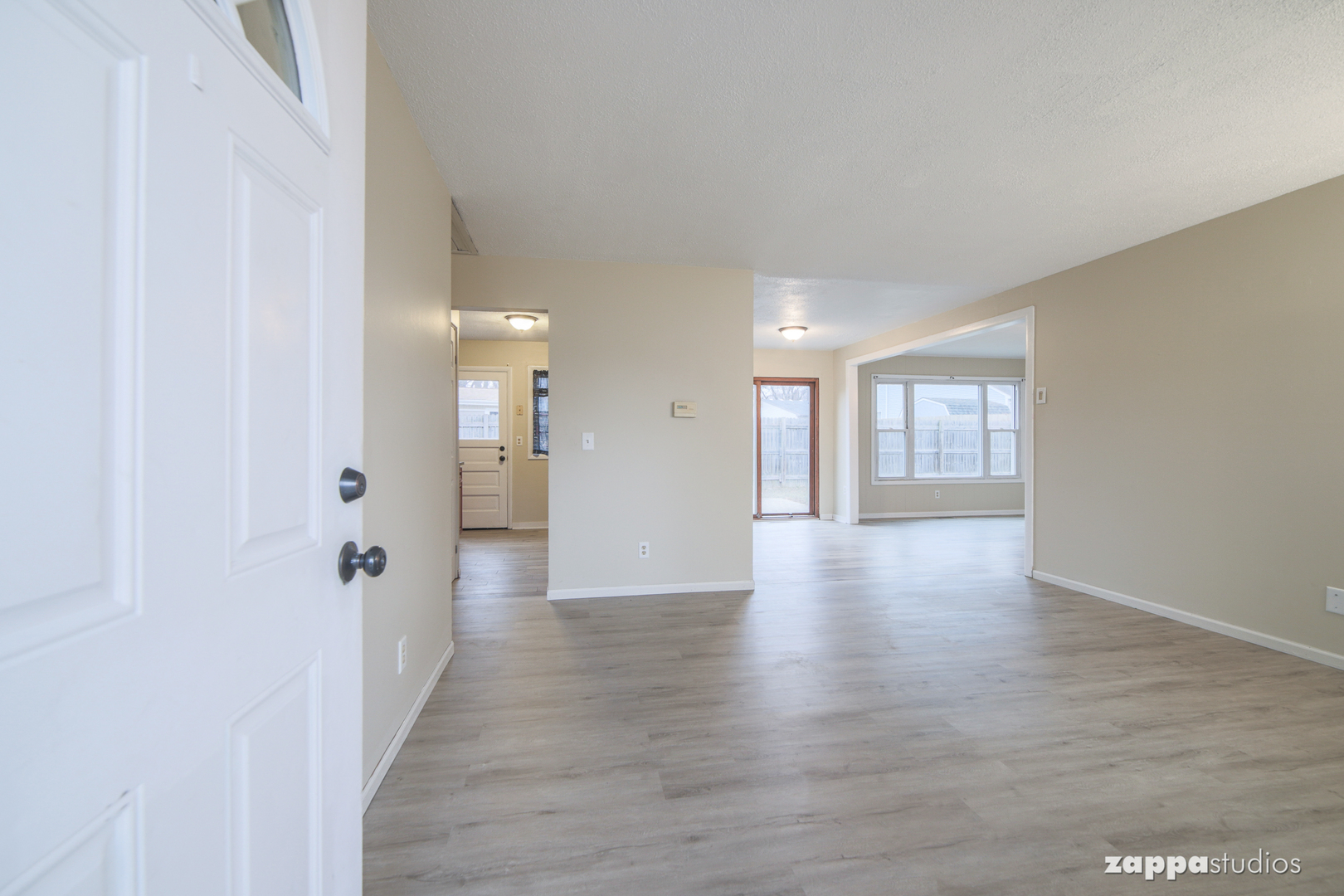 58 Long Beach Road Montgomery, IL 60538 - Photo 4 of 35 a view of a hallway with wooden floor and a bathroom