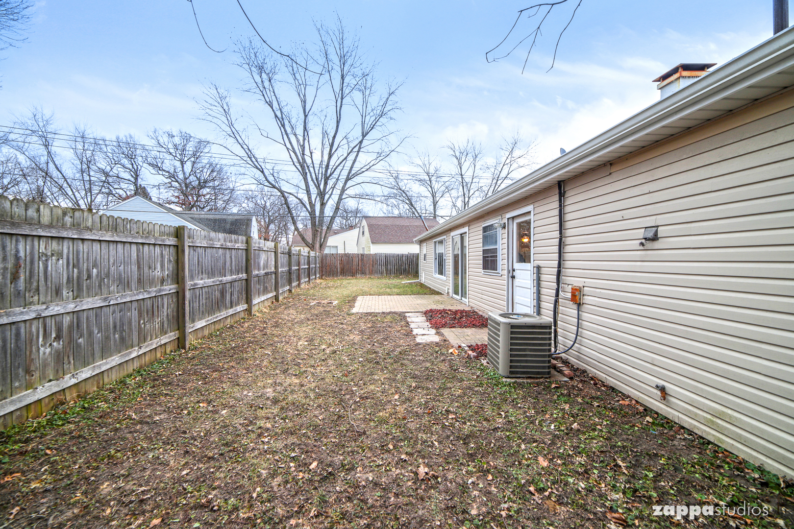58 Long Beach Road Montgomery, IL 60538 - Photo 32 of 35 a view of a house with a yard and wooden fence