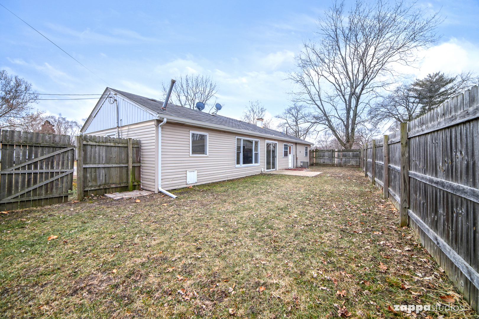 58 Long Beach Road Montgomery, IL 60538 - Photo 34 of 35 a view of a house with a yard and wooden fence