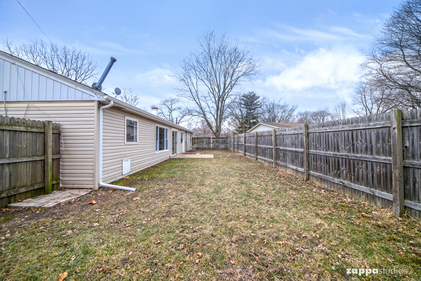 58 Long Beach Road Montgomery, IL 60538 - Photo 35 of 35 a view of backyard with wooden fence