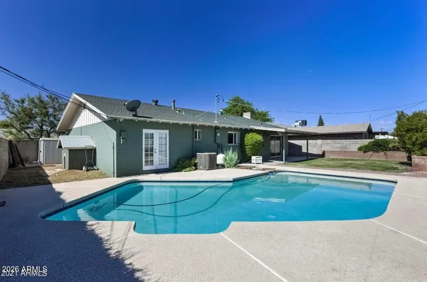 a view of a house with swimming pool