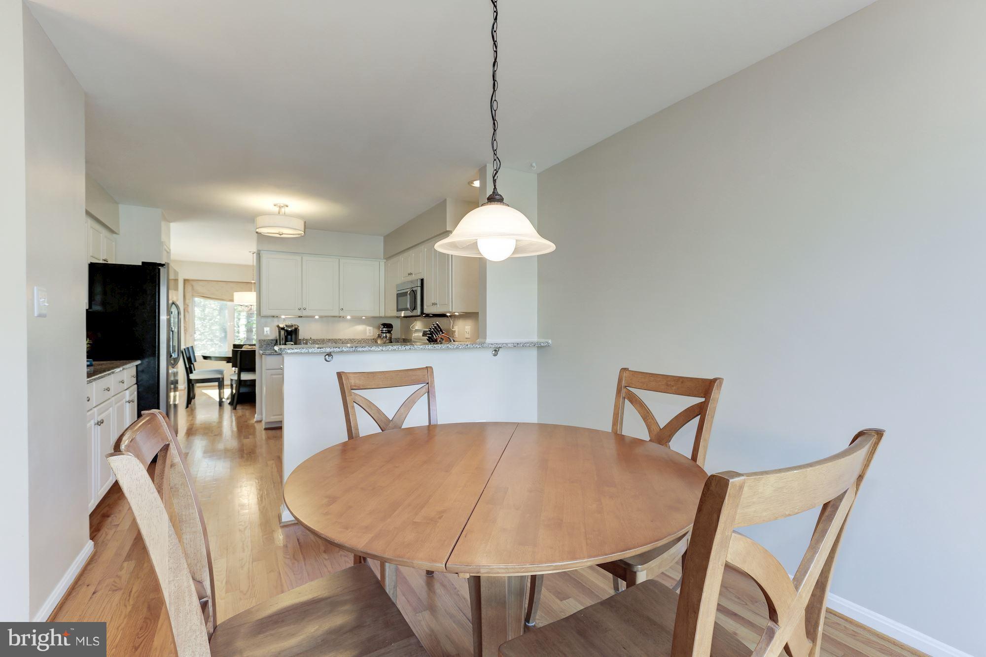 1322 Wedgewood Manor Way Reston, VA 20194 - Photo 14 of 30 a dining room with furniture and window