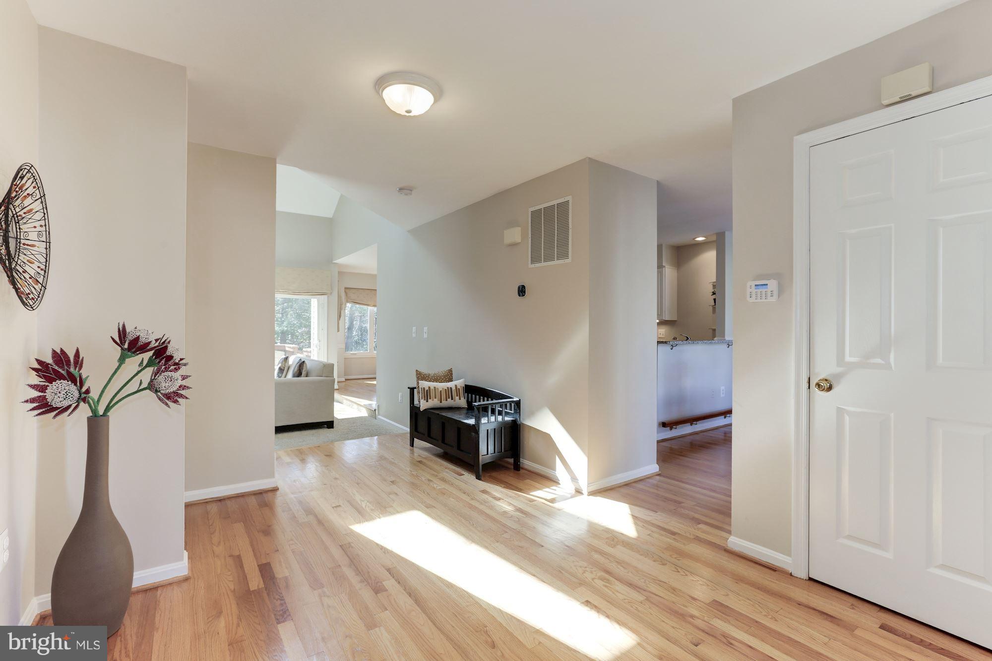 1322 Wedgewood Manor Way Reston, VA 20194 - Photo 3 of 30 a living room with furniture and a wooden floor