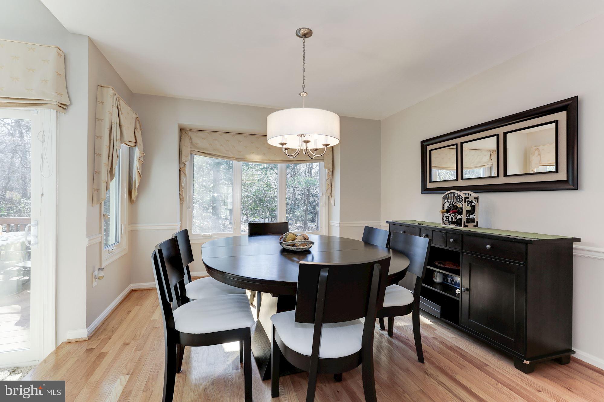 1322 Wedgewood Manor Way Reston, VA 20194 - Photo 5 of 30 a view of a dining room with a table and chairs