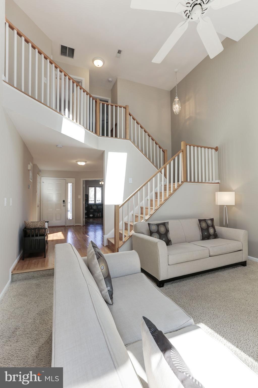 1322 Wedgewood Manor Way Reston, VA 20194 - Photo 10 of 30 a living room with furniture and a chandelier