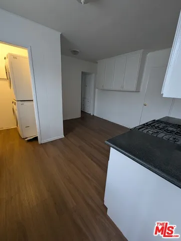 a kitchen with a wooden floor