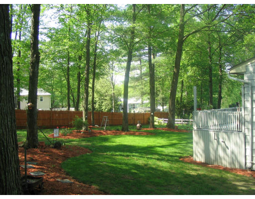 161 Goldthwaite Road Northbridge, MA 01588 - Photo 3 of 5 a view of a backyard with a garden and trees