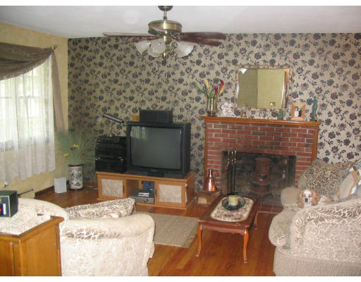 161 Goldthwaite Road Northbridge, MA 01588 - Photo 5 of 5 a living room with furniture and a fireplace