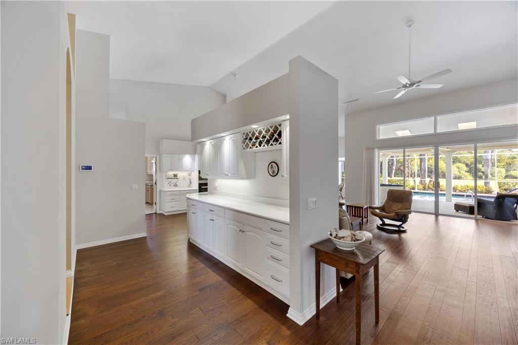 8992 Lely Island Circle Naples, FL 34113 - Photo 18 of 42 a large white kitchen with a large window