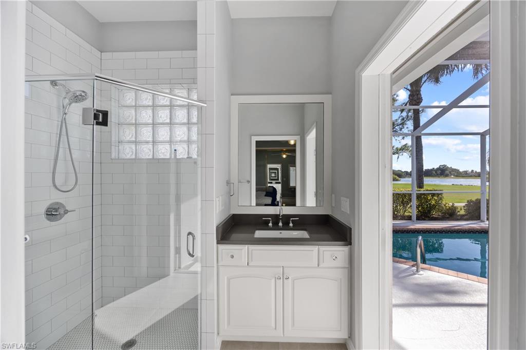 8992 Lely Island Circle Naples, FL 34113 - Photo 28 of 42 a bathroom with a shower