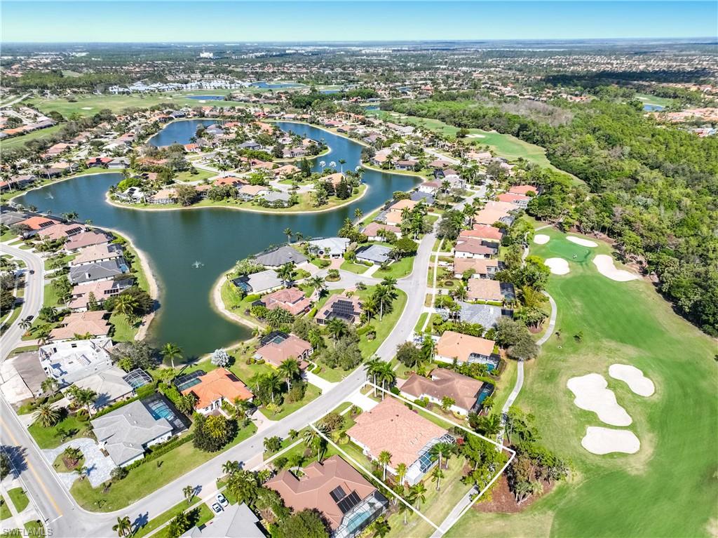 8992 Lely Island Circle Naples, FL 34113 - Photo 3 of 42 an aerial view of a residential houses with city view