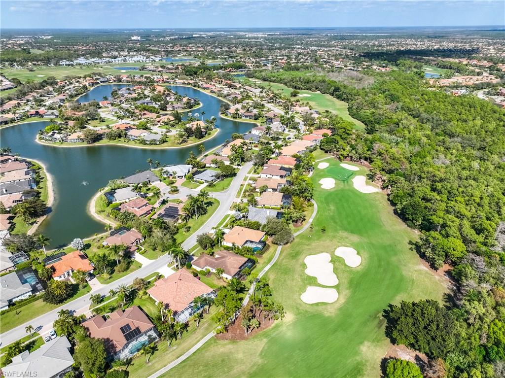 8992 Lely Island Circle Naples, FL 34113 - Photo 38 of 42 an aerial view of a residential houses with outdoor space and trees