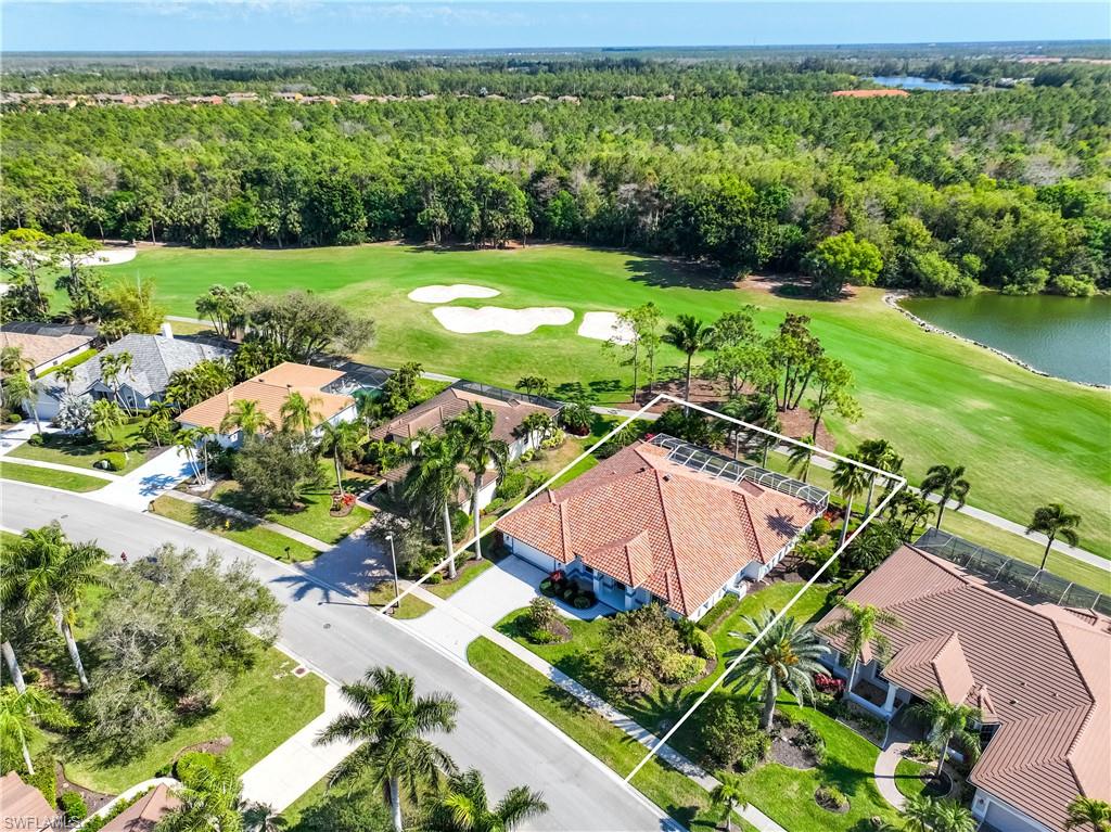 8992 Lely Island Circle Naples, FL 34113 - Photo 39 of 42 an aerial view of a garden