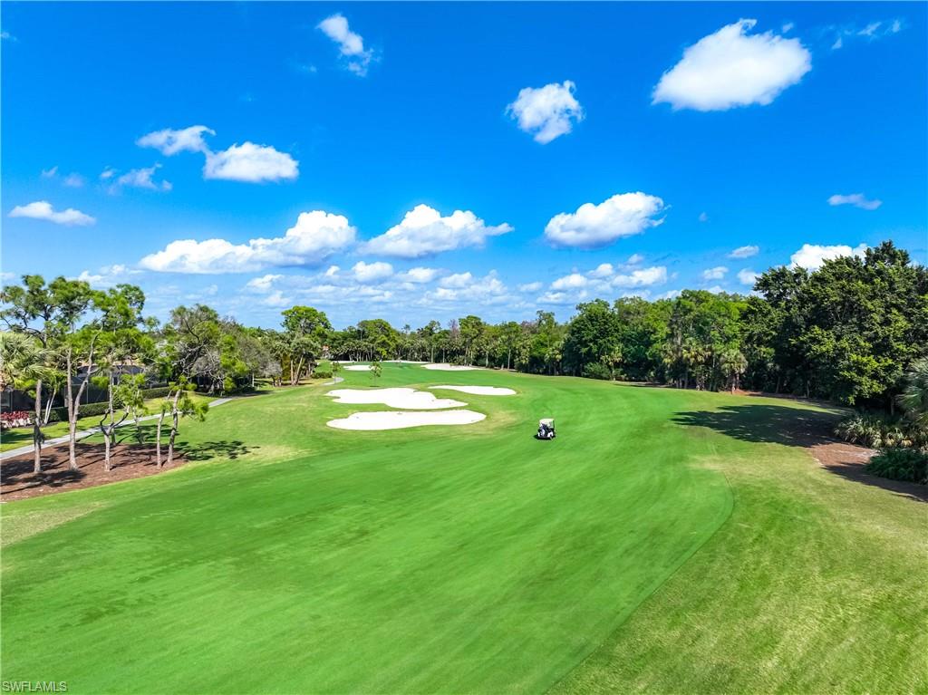 8992 Lely Island Circle Naples, FL 34113 - Photo 41 of 42 a view of a golf course with a lake