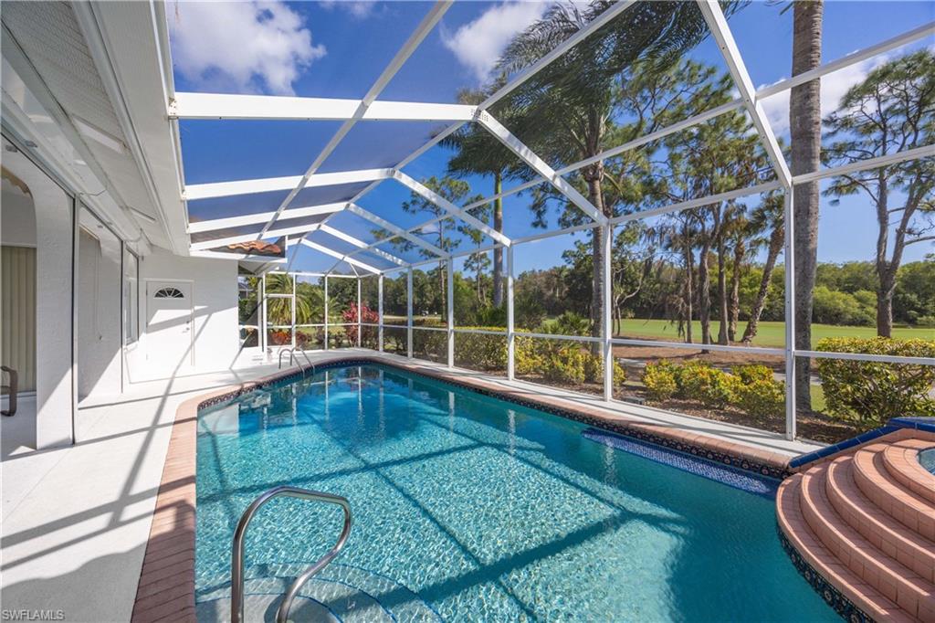 8992 Lely Island Circle Naples, FL 34113 - Photo 6 of 42 a view of swimming pool with seating area