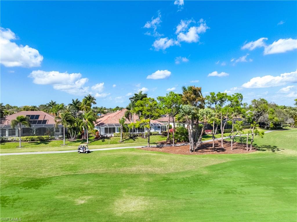 8992 Lely Island Circle Naples, FL 34113 - Photo 7 of 42 a view of a building with a big yard