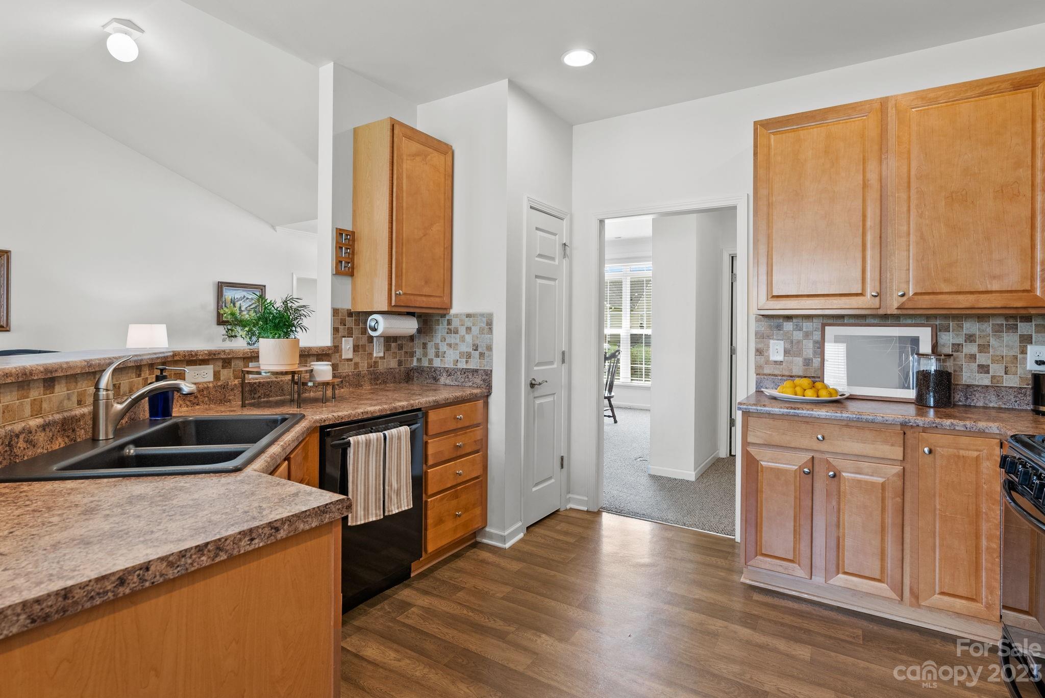 60 West Hiawassee Road Fletcher, NC 28732 - Photo 16 of 40 a kitchen with a sink stove and cabinets