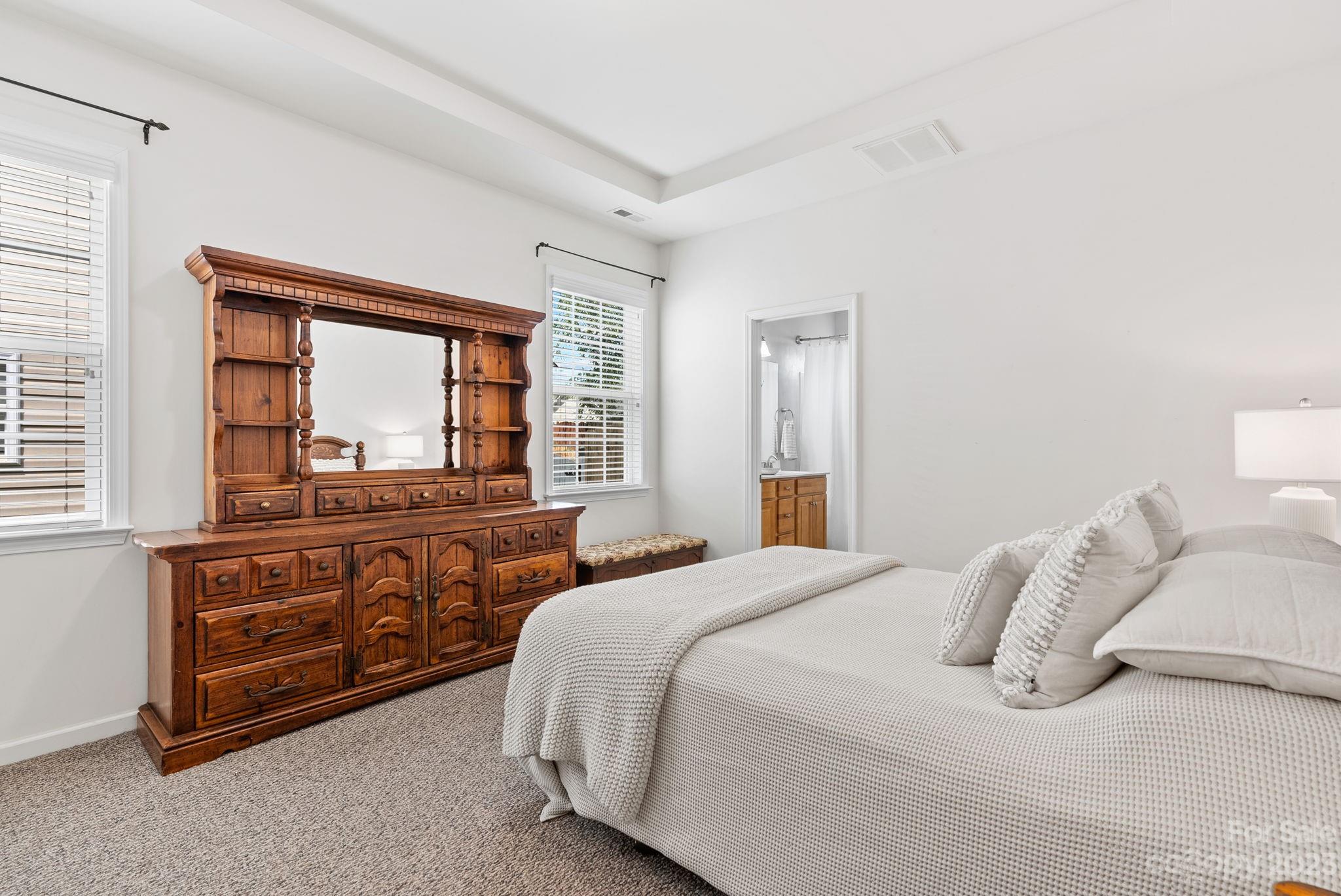60 West Hiawassee Road Fletcher, NC 28732 - Photo 17 of 40 a bedroom with a bed and a large window