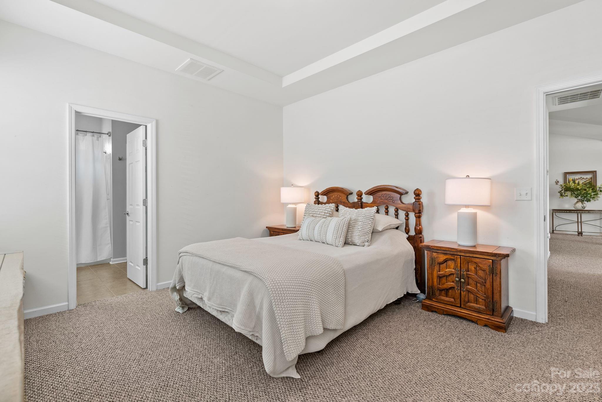 60 West Hiawassee Road Fletcher, NC 28732 - Photo 18 of 40 a bedroom with a bed and a night stand