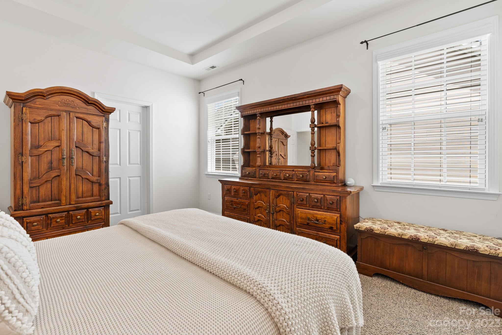 60 West Hiawassee Road Fletcher, NC 28732 - Photo 19 of 40 a bedroom with a bed and wooden floor